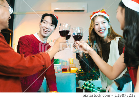 Dinner and group of people celebrating together at Merry Christmas and Happy New Year. 119875232