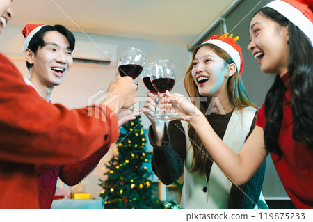 Dinner and group of people celebrating together at Merry Christmas and Happy New Year. 119875233