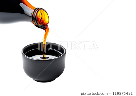 Dark soy sauce poured from bottle isolated on white transparent background. 119875451