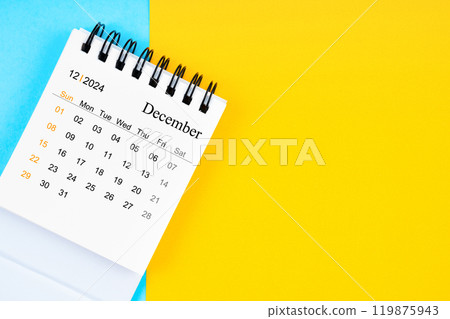 December 2024, Monthly desk calendar for 2024 year on yellow and blue background. December 2024, Monthly desk calendar for 2024 year on yellow and blue background. 119875943