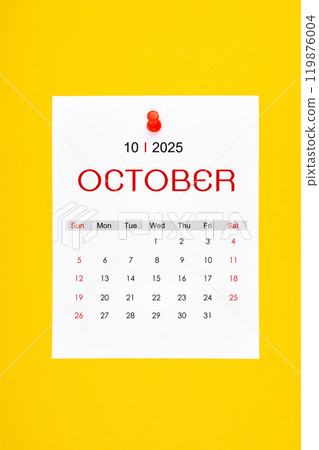 October 2025 calendar page with push pin on yellow background. October 2025 calendar page with push pin on yellow background. 119876004