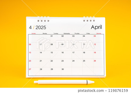 April 2025, Monthly desk calendar for 2025 year and pen on yellow background. April 2025, Monthly desk calendar for 2025 year and pen on yellow background. 119876159