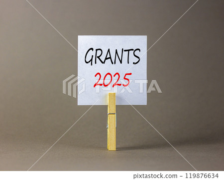 Planning grants 2025 new year symbol. Concept words Grants 2025 on beautiful white paper on wooden clothespin. Beautiful grey background. Business grants 2025 new year concept. Copy space. Planning grants 2025 new year symbol. Concept words Grants 2025 on beautiful white paper on wooden clothespin. Beautiful grey background. Business grants 2025 new year concept. Copy space. 119876634