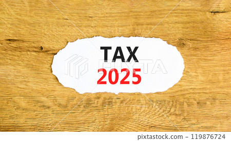 Planning tax 2025 new year symbol. Concept words Tax 2025 on beautiful white paper. Beautiful wooden background. Business tax 2025 new year concept. Copy space. 119876724