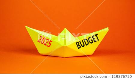Planning 2025 budget new year symbol. Concept words 2025 Budget on beautiful yellow paper boat. Beautiful orange paper background. Business 2025 budget new year concept. Copy space. Planning 2025 budget new year symbol. Concept words 2025 Budget on beautiful yellow paper boat. Beautiful orange paper background. Business 2025 budget new year concept. Copy space. 119876730