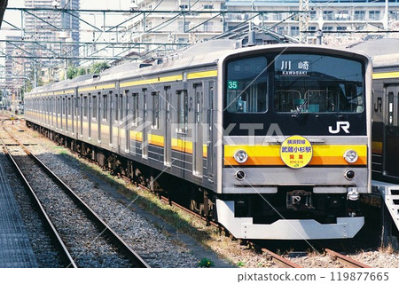 A Nambu Line 205 series train parked in a storage track (headmark commemorating the opening of Musashi-Kosugi Station on the Yokosuka Line displayed) 119877665