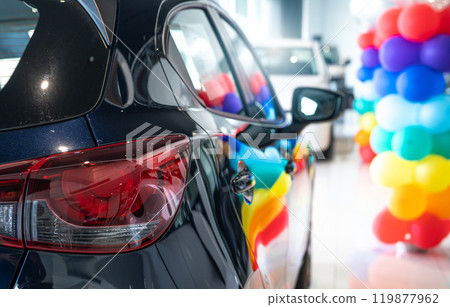 Car parked in luxury showroom. Car dealership office. Car showroom business. New car parked in modern showroom. Auto for sale and rent business. Automobile leasing and insurance. Electric automobile. 119877962