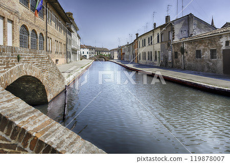 Walking among the picturesque canals of Comacchio, Italy Walking among the picturesque canals of Comacchio, Italy 119878007