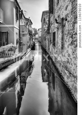 Walking among the picturesque canals of Comacchio, Italy Walking among the picturesque canals of Comacchio, Italy 119878010