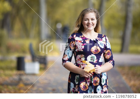 Happy girl in autumn park with leaves. Happy girl in autumn park with leaves. 119878052