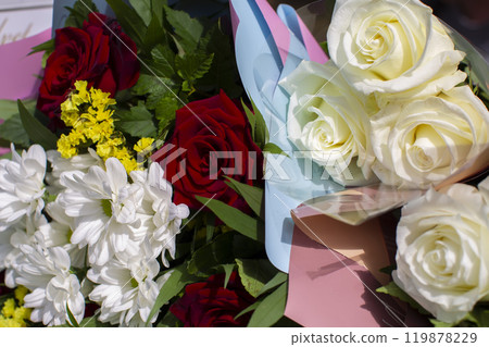 Background bouquets of chrysanthemums, white and red roses. Background bouquets of chrysanthemums, white and red roses. 119878229