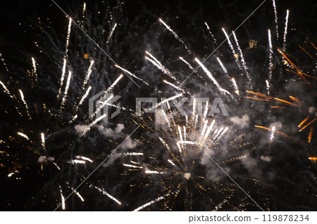 Golden rays of fireworks on black background. Festive night background. 119878234