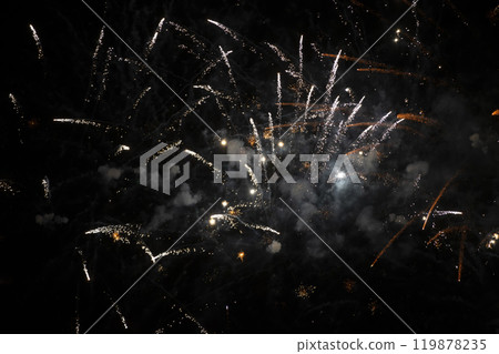 Bright stripes of fireworks with smoke and bokeh on a black background. 119878235