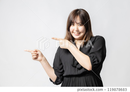 Woman in black clothes pointing Woman in black clothes pointing 119878683