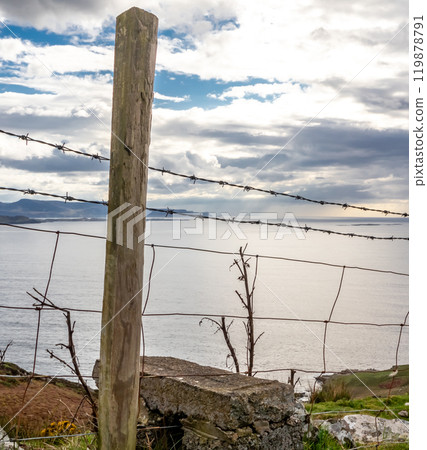 Fence next to the coastal single track road between Meenacross and Crohy Head south of Dungloe, County Donegal - Ireland 119878791