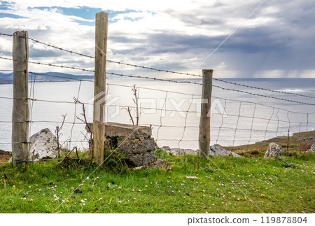 Fence next to the coastal single track road between Meenacross and Crohy Head south of Dungloe, County Donegal - Ireland 119878804