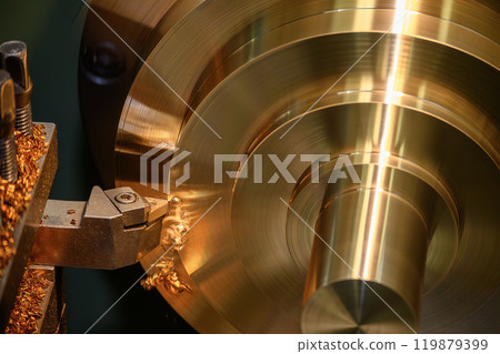 The lathe machine finish cut the brass material parts by lathe tools. 119879399