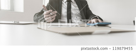 Accountant or businessman working on his accounts Accountant or businessman working on his accounts 119879455