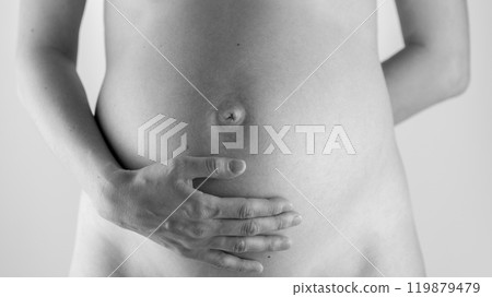 Beautiful wonder of new life - pregnant woman holding her belly 119879479
