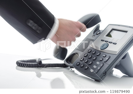 Blurred male hand using a phone 119879490