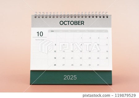 October 2025 desk calendar isolated in pink background. October 2025 desk calendar isolated in pink background. 119879529
