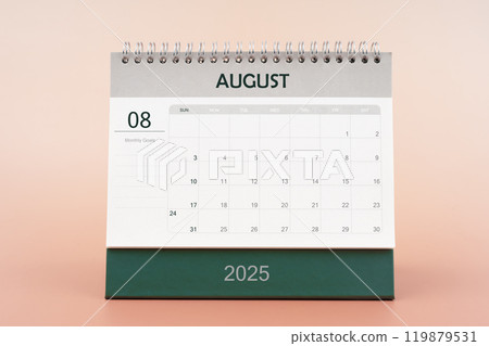 August 2025 desk calendar isolated in pink background. August 2025 desk calendar isolated in pink background. 119879531