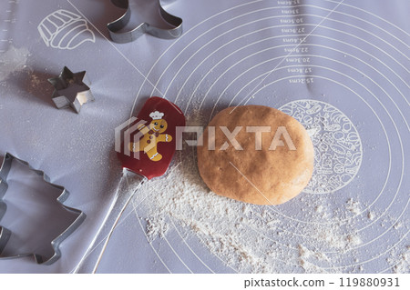 Gingerbread dough with Christmas cookies shape, top view. Christmas decoration. Advent concept. Shortbread handmade cookies for winter holidays. Making Christmas biscuits. Gingerbread dough with Christmas cookies shape, top view. Christmas decoration. Advent concept. Shortbread handmade cookies for winter holidays. Making Christmas biscuits. 119880931