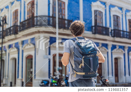 Male tourist in front of Casa de los Azulejos in Villahermosa, Mexico. Quintana Roo travel, cultural exploration, and historic architecture concept 119881357