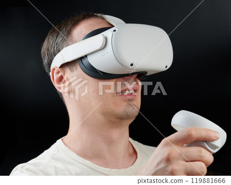 Man playing in Virtual reality Man playing in Virtual reality 119881666