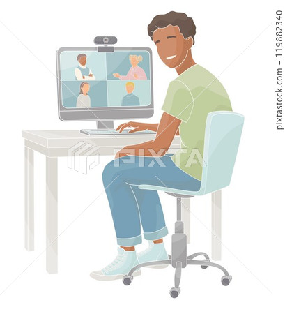 African American boy sits in a chair at a table working on a computer videoconferencing African American boy sits in a chair at a table working on a computer videoconferencing 119882340