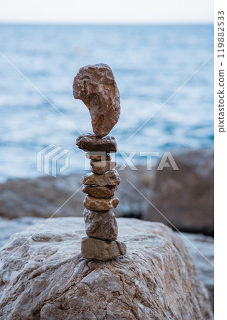 Stone pyramids on the beach 119882533