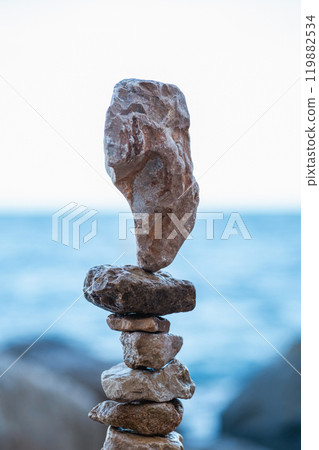 Stone pyramids on the beach Stone pyramids on the beach 119882534