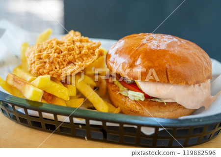Tasty big size burger with french fries, beef burger with a lettuce Tasty big size burger with french fries, beef burger with a lettuce 119882596