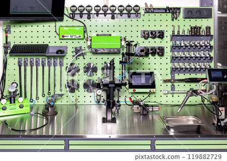 Advanced diagnostic tools and modern industrial equipment in workshop setup in an organized workplace, the concept of machine calibration. Advanced diagnostic tools and modern industrial equipment in workshop setup in an organized workplace, the concept of machine calibration. 119882729