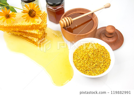 Fresh flower honey in a wooden bowl, spoon and honeycomb. vitamin food for health and life 119882991