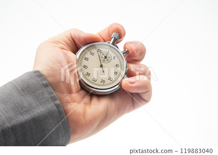 hand with a mechanical analog stopwatch on a white background hand with a mechanical analog stopwatch on a white background 119883040
