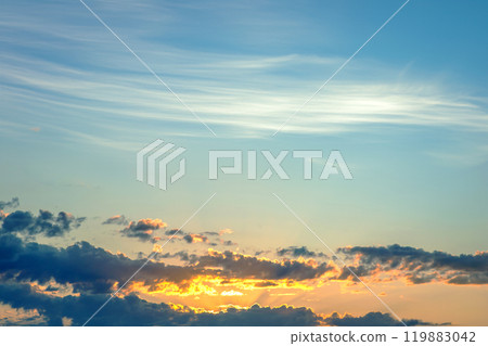 captivating twilight sky with bold streaks of orange and gold fading into a dark blue captivating twilight sky with bold streaks of orange and gold fading into a dark blue 119883042