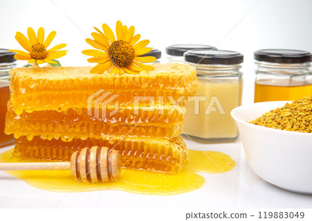 Fresh flower honey in a wooden bowl, spoon and honeycomb. vitamin food for health and life Fresh flower honey in a wooden bowl, spoon and honeycomb. vitamin food for health and life 119883049