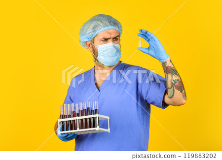 blood virus test. doctor wearing surgical mask while testing. nurse examines blood samples in lab. antibody for SARS can neutralize coronavirus. creation of antiviral vaccine. clinical trials 119883202