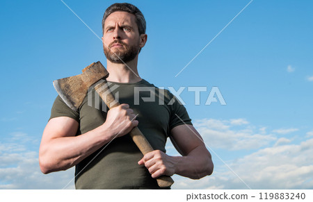 strong man with axe. caucasian man hold ax. brutal man on sky background with copy space 119883240