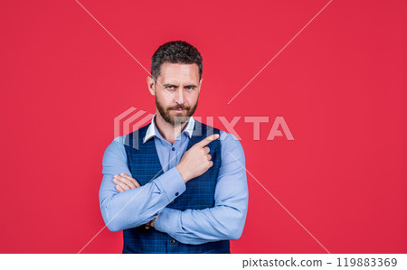 mature ambitious man businessman in businesslike suit pointing finger on copy space, offer mature ambitious man businessman in businesslike suit pointing finger on copy space, offer 119883369