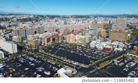 Aerial view of the buildings in Masago Honmachi from Kamoike Port in Kagoshima City 119883402