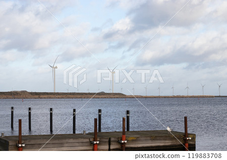 Wind turbine farm power genarator in beautiful nature landscape for production of renewable green energy. 119883708