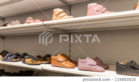 Children's shoe store. Shelf in the store with baby winter boots. Children's shoe store. Shelf in the store with baby winter boots. 119883810
