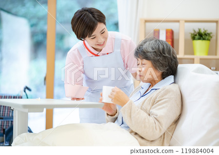 A female caregiver assisting with gargling A female caregiver assisting with gargling 119884004