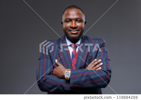 Portrait of handsome African American male businessman on gray background, stylish manager, office worker Portrait of handsome African American male businessman on gray background, stylish manager, office worker 119884208