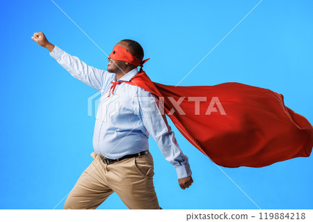 African American overweight guy in superman costume, in flying pose on blue background, concept of speed, superpowers and super abilities African American overweight guy in superman costume, in flying pose on blue background, concept of speed, superpowers and super abilities 119884218