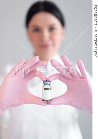 Cosmetologist holding medicine bottle with mockup 119885252