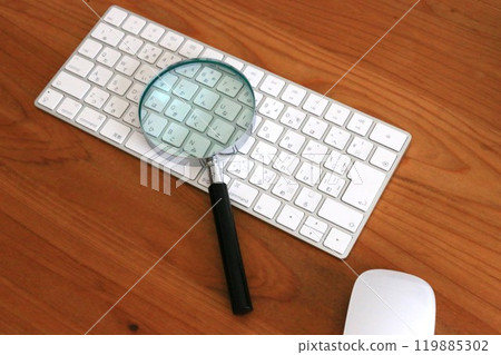 Computer and magnifying glass, virus protection, personal information leakage prevention 119885302