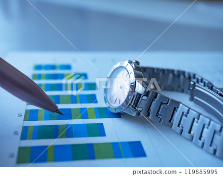 Graph and watch on a table 119885995